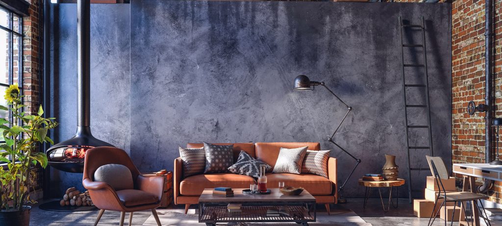 industrieel interieur donkere wand cognackleur sofa hanghaard